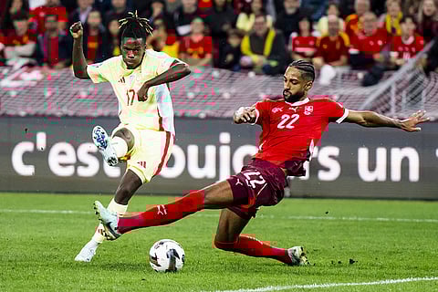 2024–25 UEFA Nations League, Switzerland vs Spain: Nico Williams, left, fights for the ball with Switzerland's defender Gregory Wuthrich